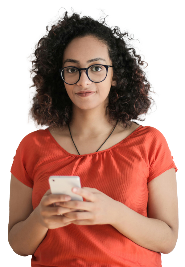 a lady wearing orange tshirt holding a white phone looking at the camera.