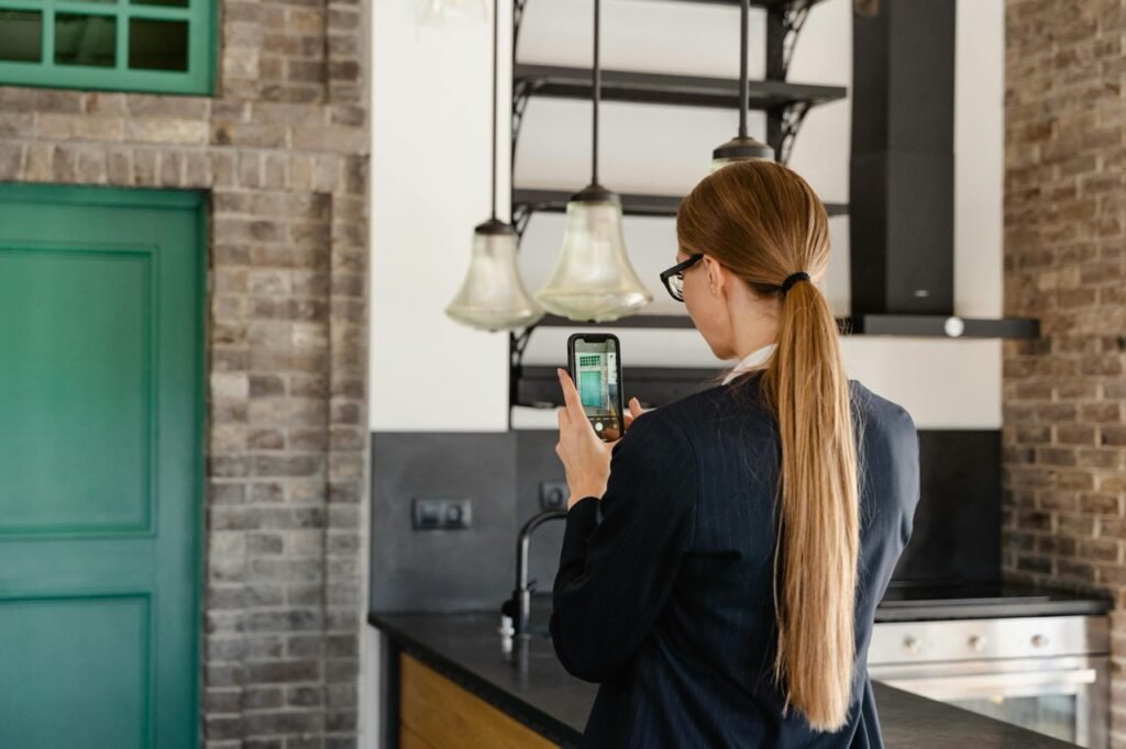 a lady taking photos of an apartment