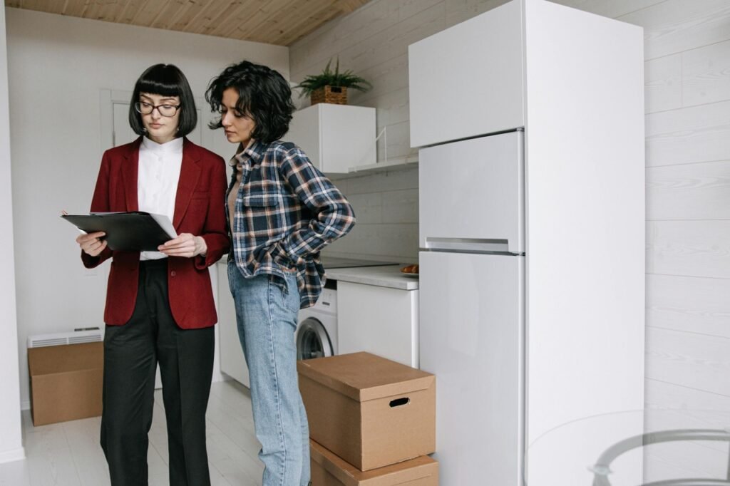 two females checking documents