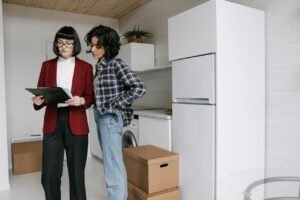 two females checking documents