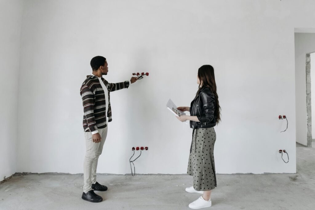 two people inspecting a room