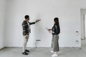 two people inspecting a room