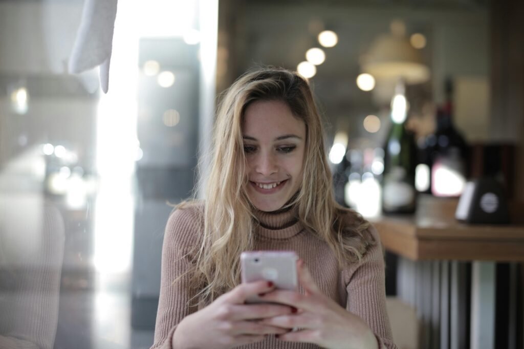 a happy female using phone to protect her deposit