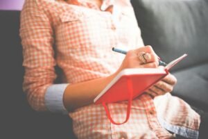 female checking things on her notebook